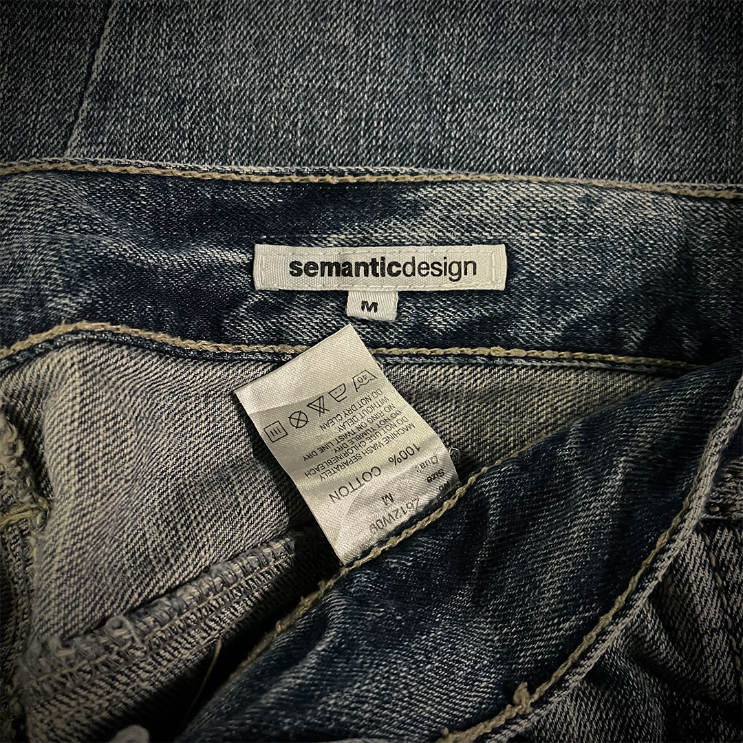 Semantic Design Thigh Lace-Up Spiral Cut Flared Jeans