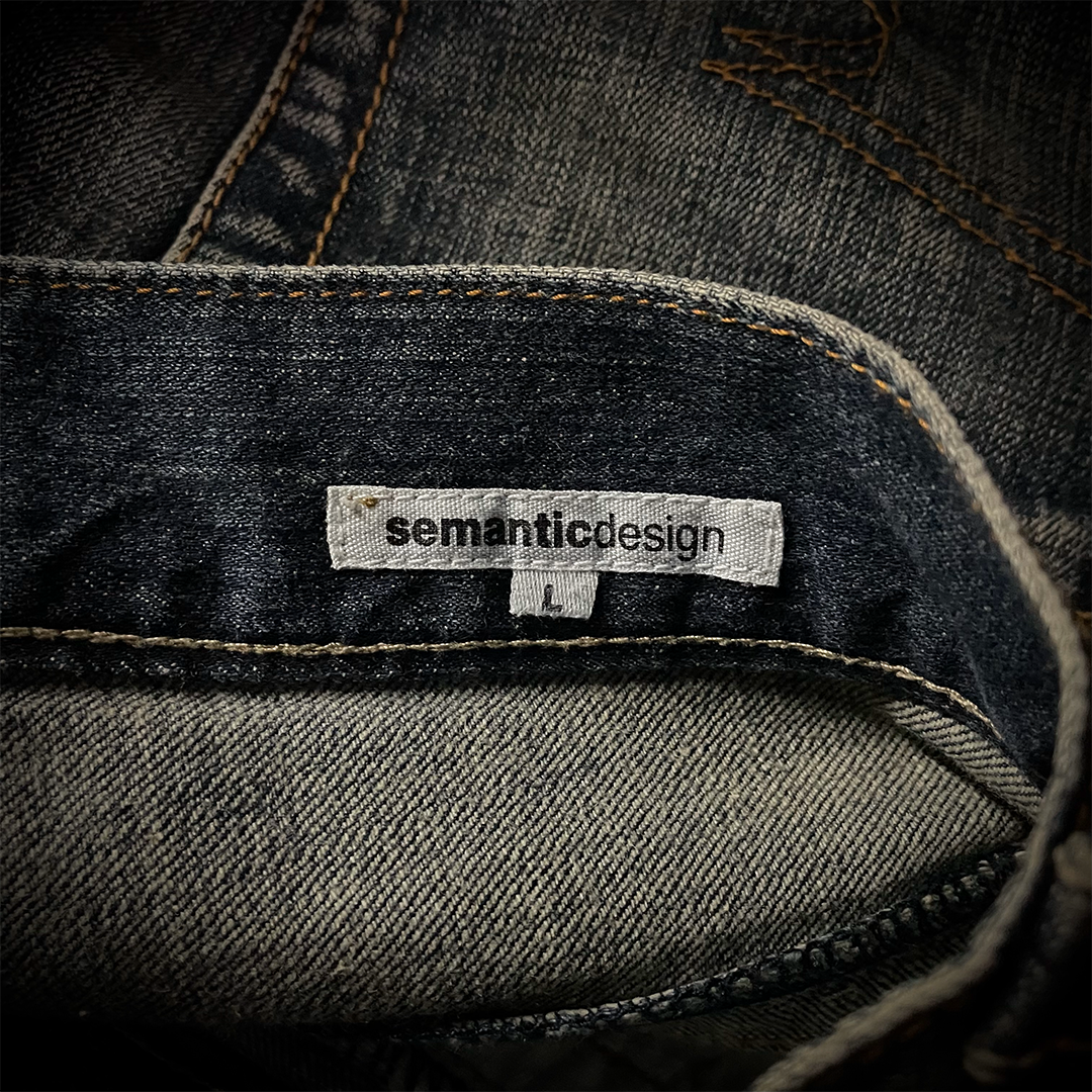 Semantic Design Snake Skin Distressed Flared Jeans