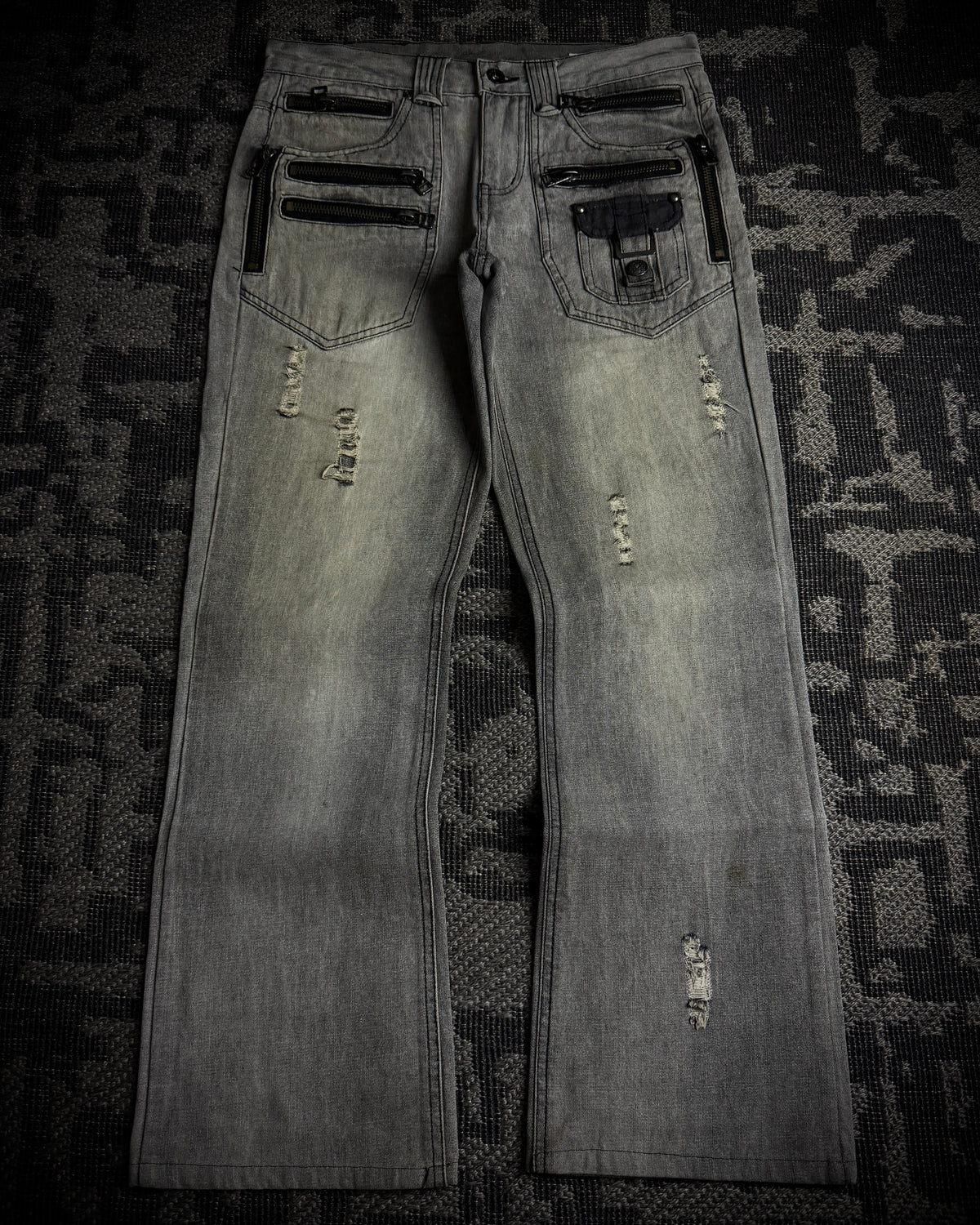 Semantic Design Multi-Zip Distressed Boot Cut Jeans