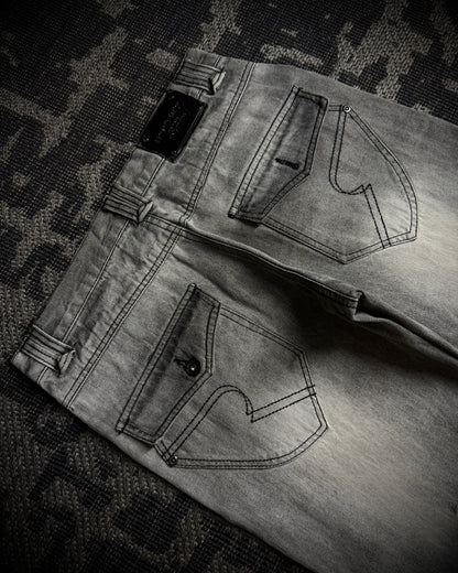 Semantic Design Multi-Zip Distressed Boot Cut Jeans