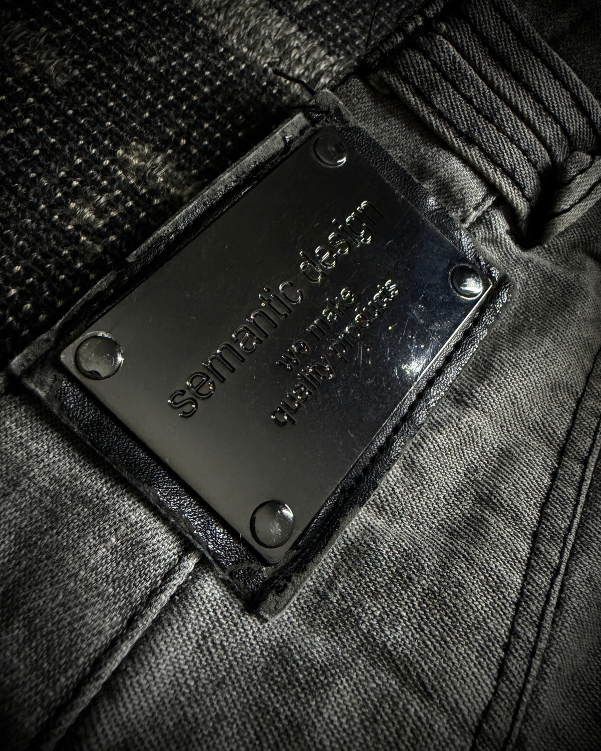 Semantic Design Multi-Zip Distressed Boot Cut Jeans