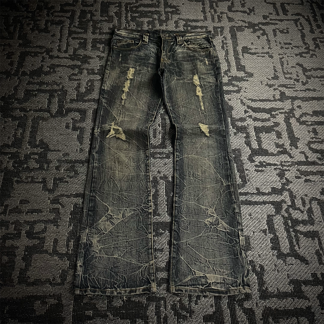 Semantic Design Back Pocket Zipper Distressed Flared Jeans