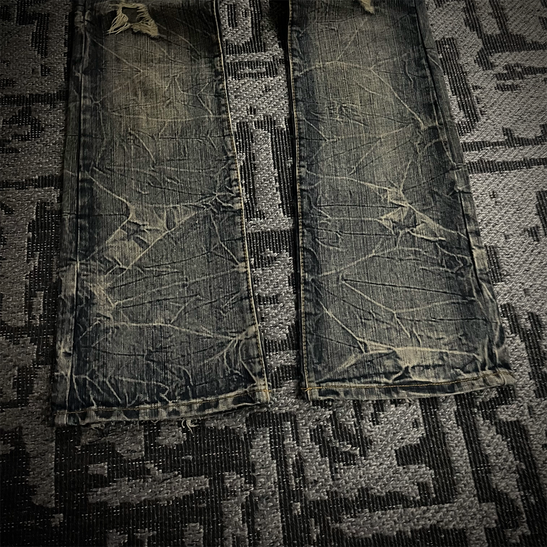 Semantic Design Back Pocket Zipper Distressed Flared Jeans