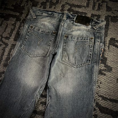 Semantic Design Thigh Lace-Up Spiral Cut Flared Jeans