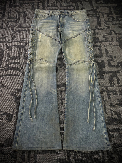 Semantic Design Thigh Lace-Up Flared Jeans