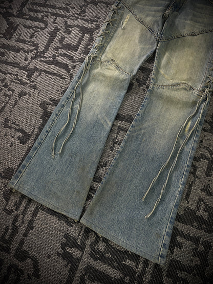 Semantic Design Thigh Lace-Up Flared Jeans