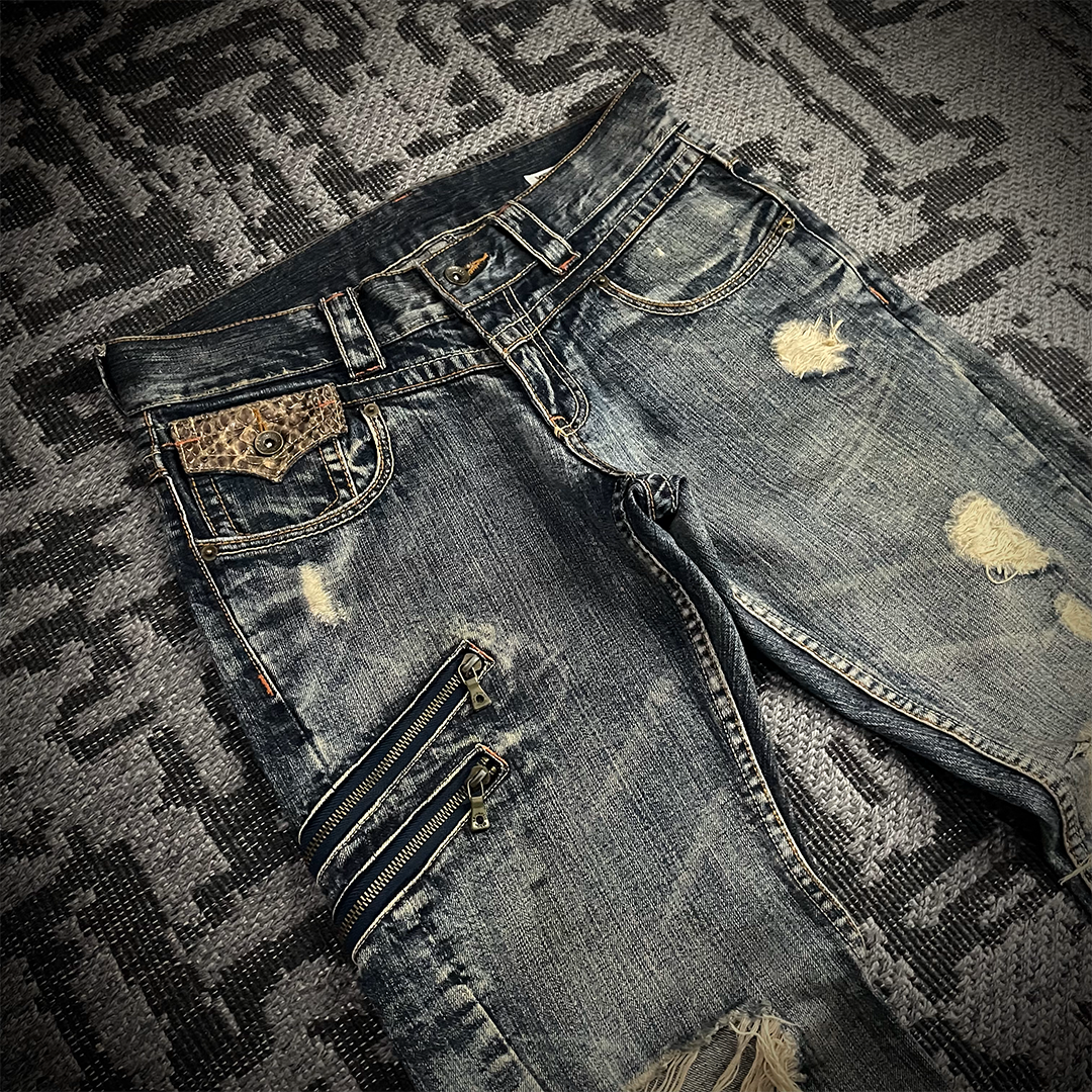 Semantic Design Snake Skin Distressed Flared Jeans