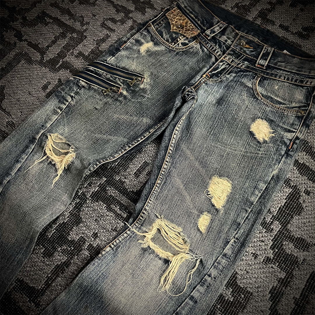 Semantic Design Snake Skin Distressed Flared Jeans