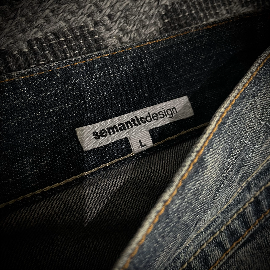 Semantic Design Snake Skin Distressed Flared Jeans