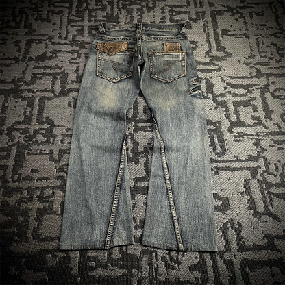 Semantic Design Snake Skin Distressed Flared Jeans