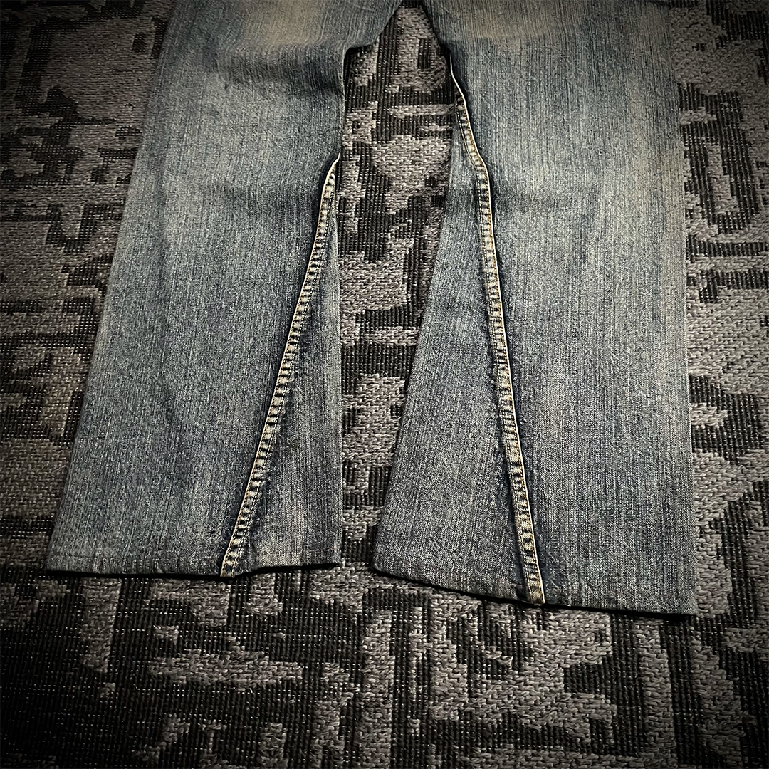 Semantic Design Snake Skin Distressed Flared Jeans