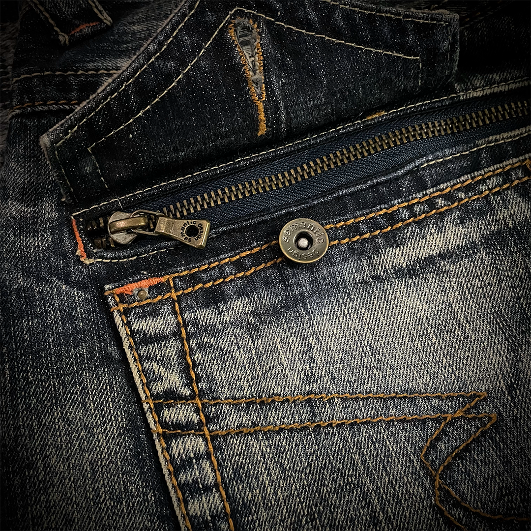 Semantic Design Snake Skin Distressed Flared Jeans