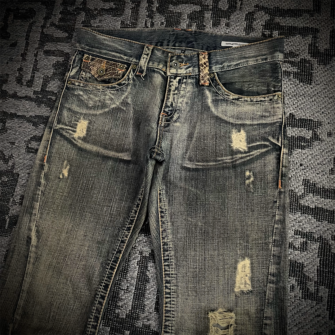 Semantic Design Snake Skin Distressed Flared Jeans