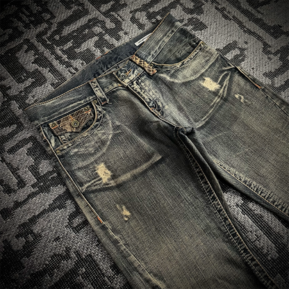 Semantic Design Snake Skin Distressed Flared Jeans