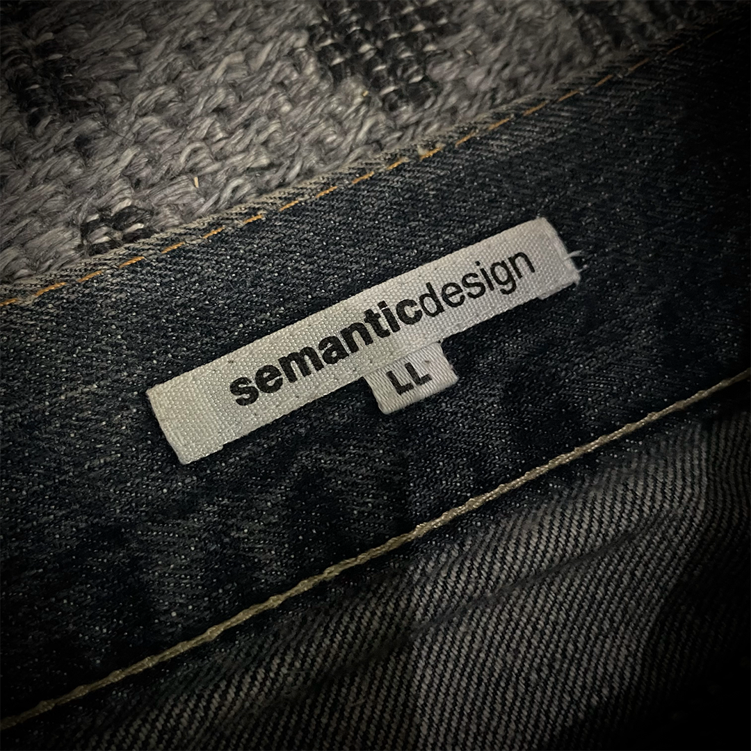 Semantic Design Snake Skin Distressed Flared Jeans