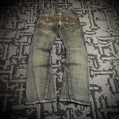 Semantic Design Snake Skin Distressed Flared Jeans