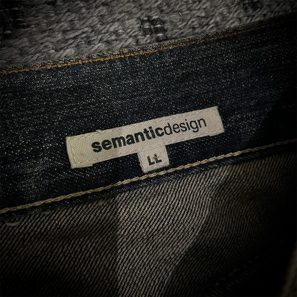 Semantic Design Snake Skin Distressed Flared Jeans