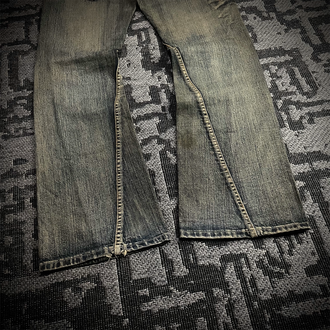 Semantic Design Snake Skin Distressed Flared Jeans