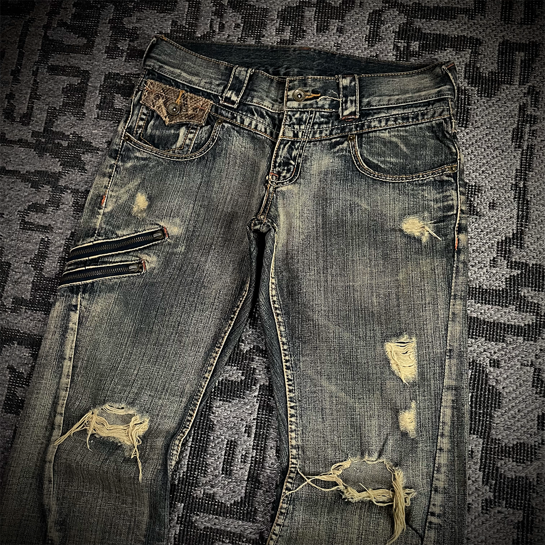 Semantic Design Snake Skin Distressed Flared Jeans