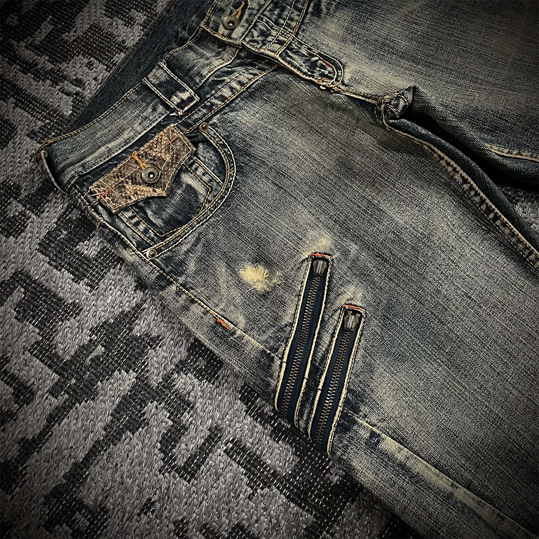 Semantic Design Snake Skin Distressed Flared Jeans