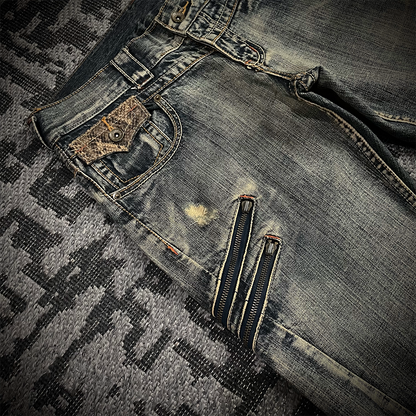 Semantic Design Snake Skin Distressed Flared Jeans