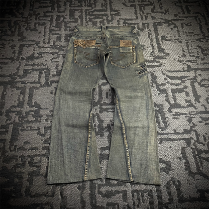 Semantic Design Snake Skin Distressed Flared Jeans
