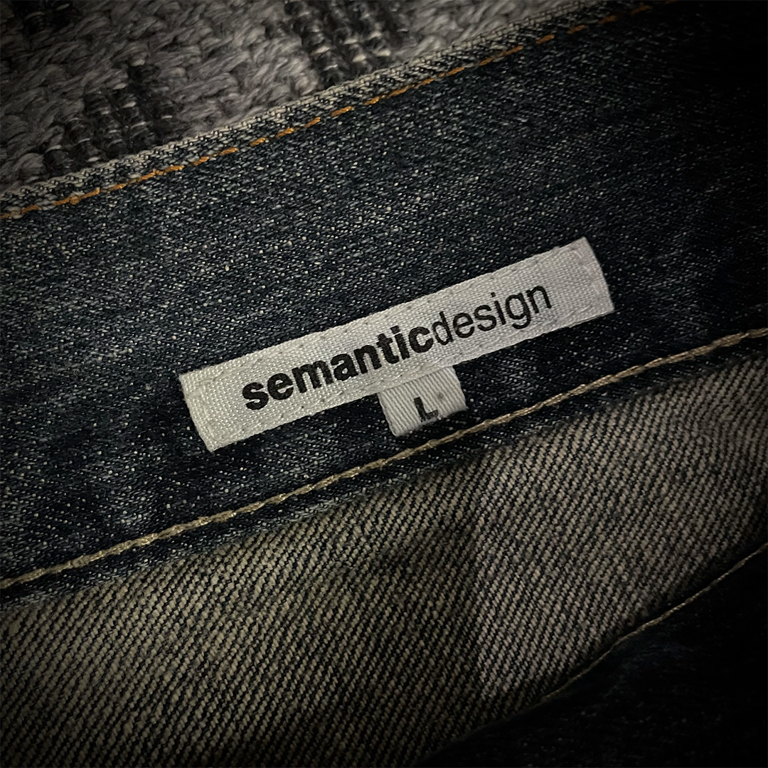 Semantic Design Snake Skin Distressed Flared Jeans