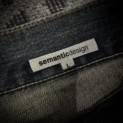 Semantic Design Snake Skin Distressed Flared Jeans