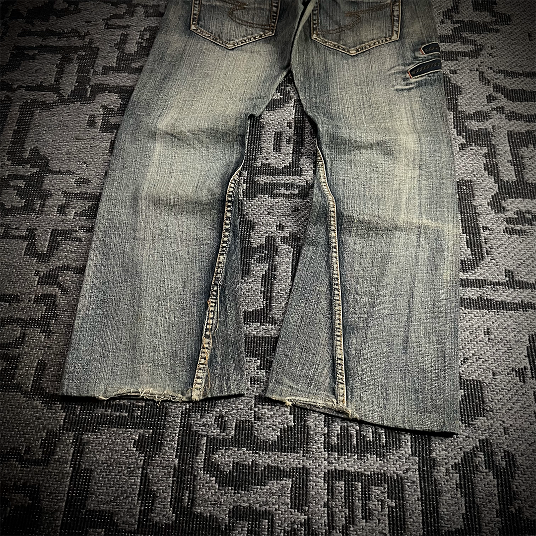 Semantic Design Snake Skin Distressed Flared Jeans