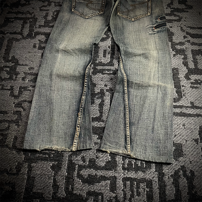 Semantic Design Snake Skin Distressed Flared Jeans